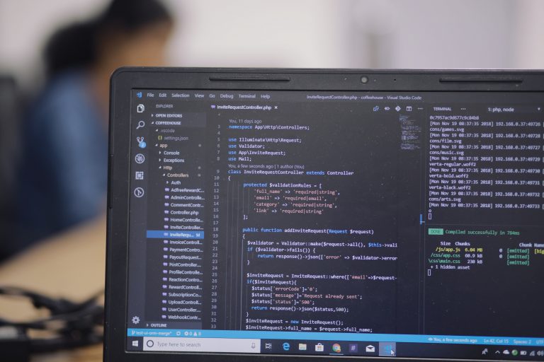 Coding on laptop on black screen