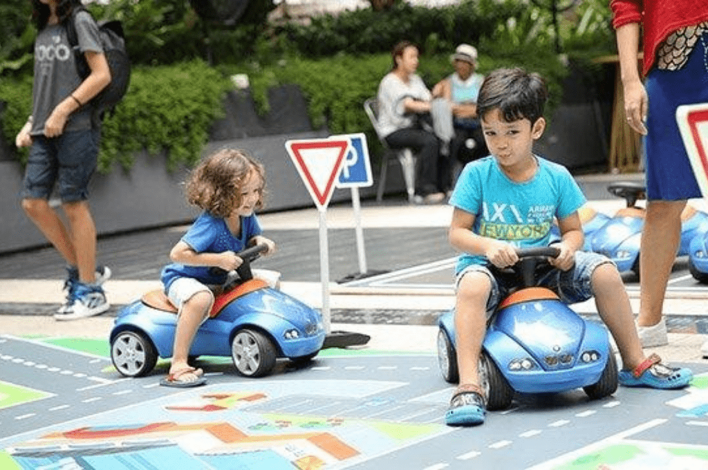 Toddlers driving toy cars