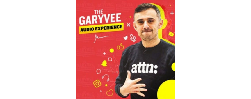 Image of Gary Vaynerchuk on a red and yellow background, with "The garyvee audio experience" sign above him