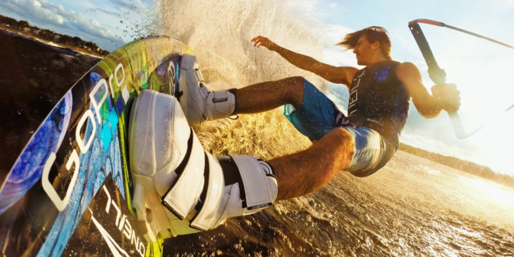 A man wakeboarding on a GoPro board.