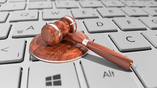 An image of a gavel on a keyboard. 