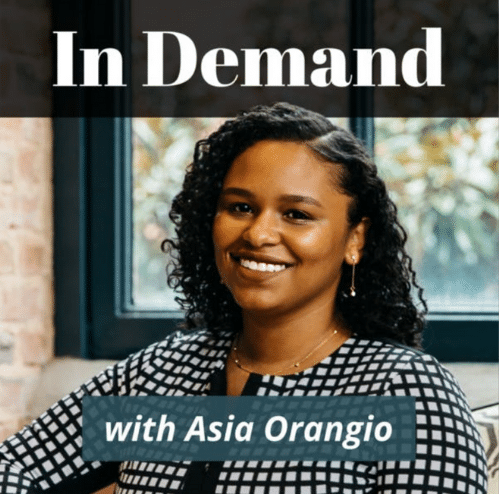 The picture has a smiling lady in the middle with the text "In Demand" with Asia Orangio.