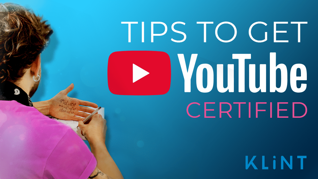 man writes on paper whilst looking at text written on the palm of his hand. Text overlaid: "Tips to get YouTube certified"